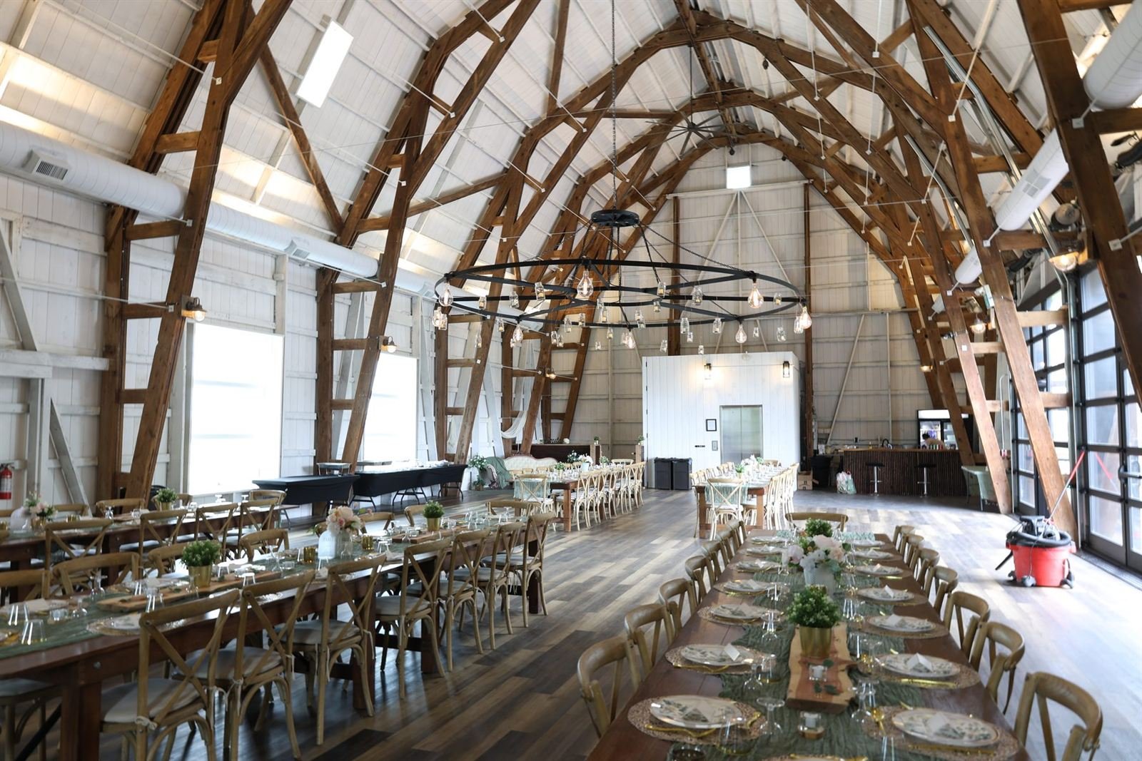 Set for the celebration — reception hall with long tables