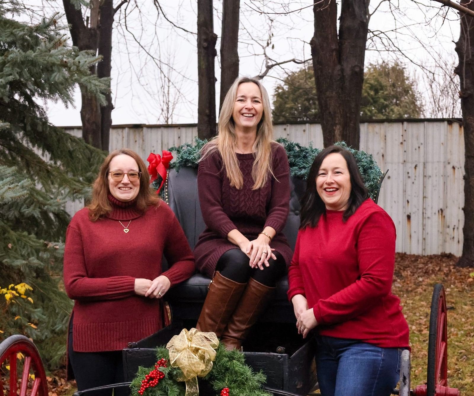Holiday trio — three women on a holiday carriage